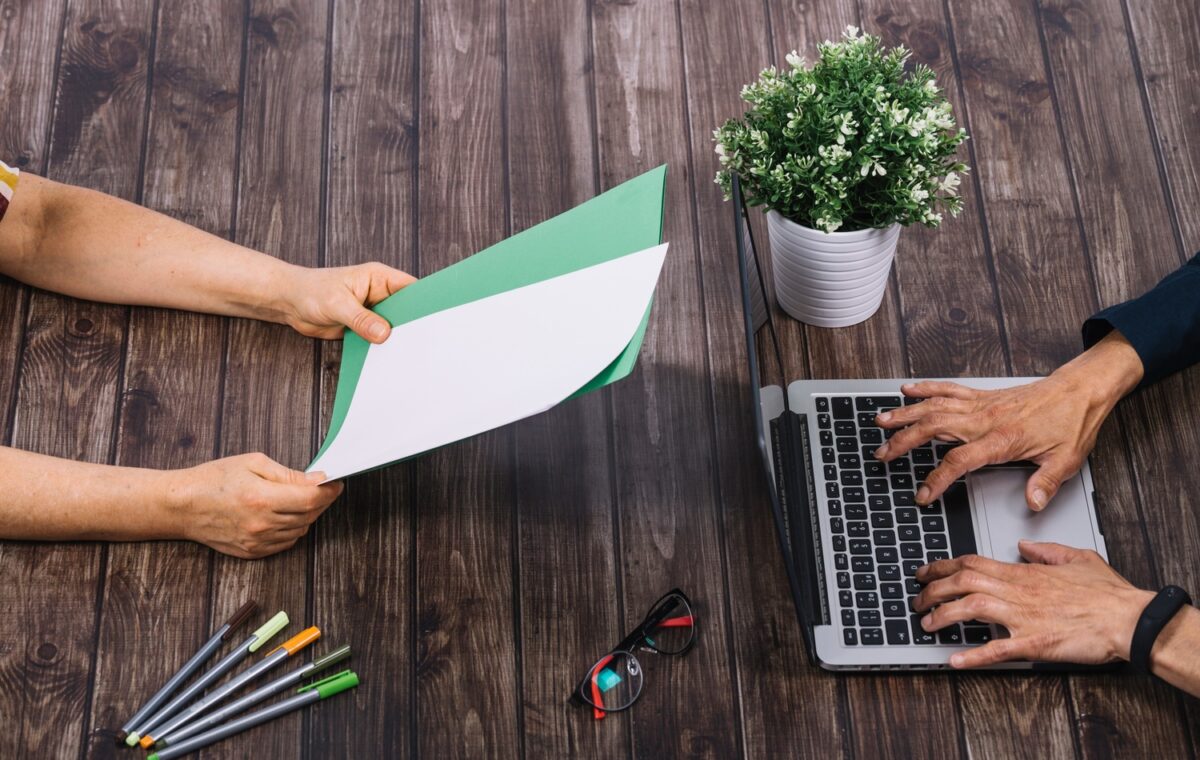 A real workspace with outreach emails, publisher research, or content planning. Avoid generic stock handshake photos.